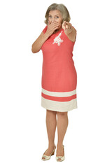 Happy senior woman pointing with finger