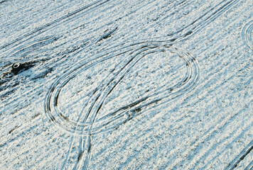 Fototapeta na wymiar Texture of a snowy winter field. Photo from above