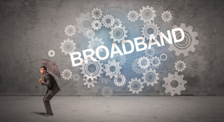 Obraz premium Businessman defending with umbrella