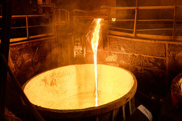 Blast furnace slag tapping. The molten slag is poured into a ladle. - obrazy, fototapety, plakaty