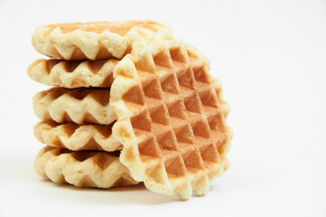 Belgian waffles on a table. holiday cookies on a white background. fresh baking concept. sweet desserts on a light texture