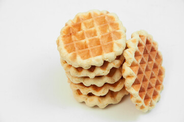 Belgian waffles on a table. holiday cookies on a white background. fresh baking concept. sweet desserts on a light texture