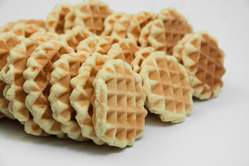 Belgian waffles on a table. holiday cookies on a white background. fresh baking concept. sweet desserts on a light texture