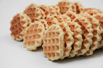 Belgian waffles on a table. holiday cookies on a white background. fresh baking concept. sweet desserts on a light texture