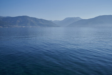 Morning seascape with mountains in adriatic sea in Montenegro