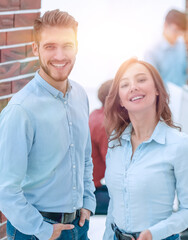 Portrait of smiling designers standing in office.