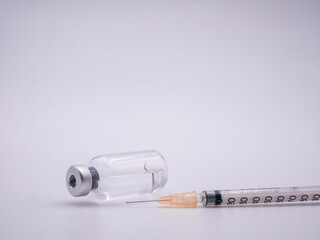 Syringe with medicine bottle isolated on white background - 482259321