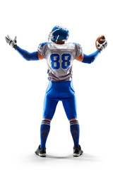 American Football player holding the ball in his hand. Joy in football. Sport emotions. Sport victory. Back view. Isolated on white background © Ruslan Shevchenko
