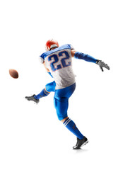 Field goal. American football sportsman in action and motion. hitting the ball. Isolated on white...