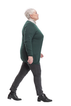 Full Body Shot Profile View Of Senior Businesswoman Walking