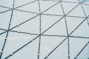 Building structures glass triangle geometry on facade of modern urban architecture. Texture. Roof....