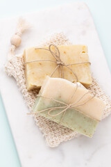 Handmade natural soap on pastel background.