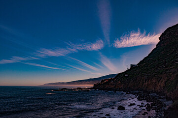 Wind clouds over the calm coast of Tenerife