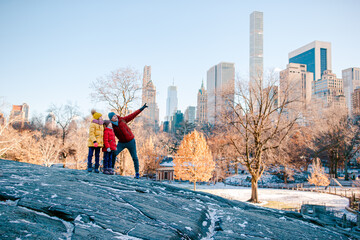 Family of father and kids in Central Park during their vacation in New York City