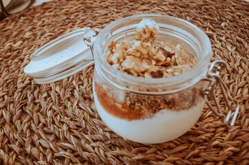 glass of yogurt with strawberry jam and oatmeal