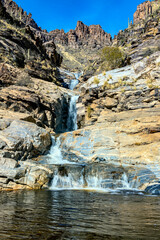Fototapeta na wymiar waterfall in the mountains, vertical image