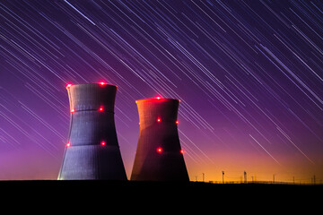 Astophotography Image of Nuclear Power Plant with Colourful Sunset and Star Trail at Night
