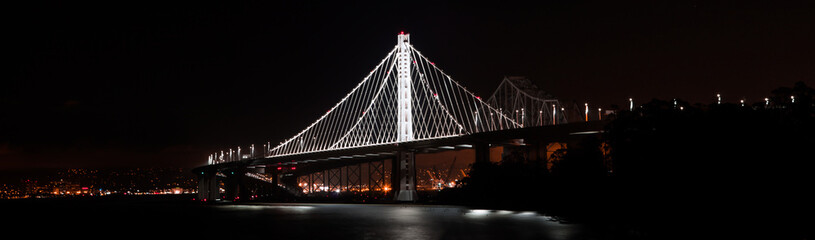 San Francisco Bay Bridge Panorama with City Lights and Black Night Backdrop
