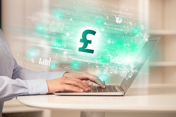 Young man watching stock market on laptop