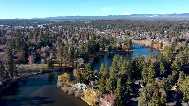 Aerial flyover of Mirror Pond above the Deschutes River in downtown Bend, Oregon.