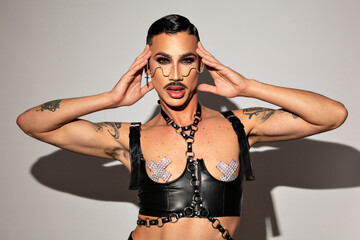 Portrait of Drag Queen dressed with black leather harness
