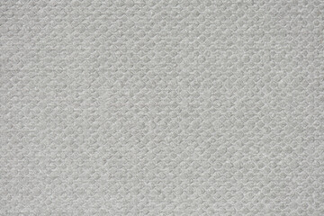 Textured cardboard background. Grey cardboard with a pronounced embossed pattern.