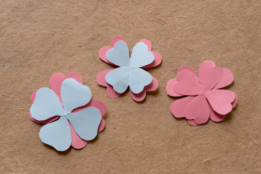 Abstract Or Stylized Paper Flowers On A Plain Brown Paper Background