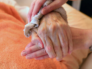 Insights into the home care of relatives in one's own family with dementia. etc. Hands of a...