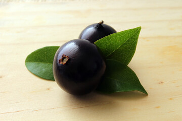 Exotic Jabuticaba fruit on wooden table