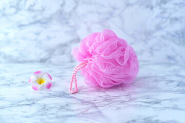 Pink bath sponge. Mesh washcloth for body care. SPA concept.