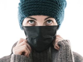 a woman wearing a mask to prevent illness