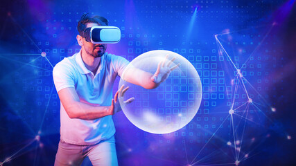 man with VR glasses tounching 3D light orb in concept of metaverse