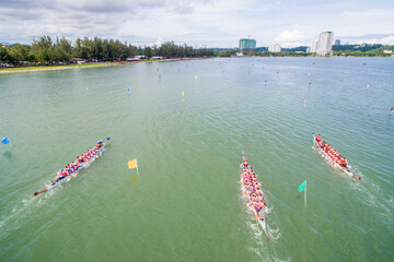 aerial view of a group of dragon boat paddler practice at Likas Bay Sabah Malaysia. Dragon boat competition is an annual event in Sabah Malaysia.