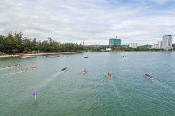 aerial view of a group of dragon boat paddler practice at Likas Bay Sabah Malaysia. Dragon boat competition is an annual event in Sabah Malaysia.