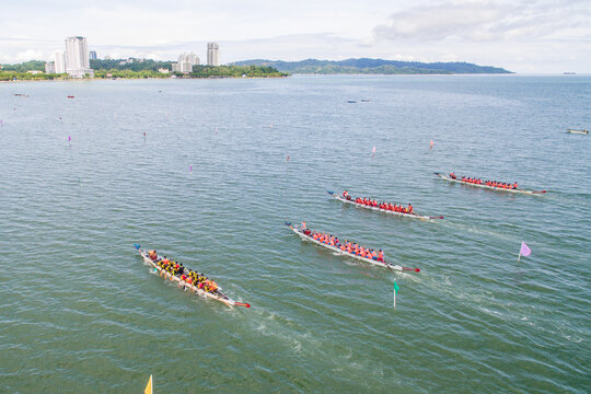 aerial view of a group of dragon boat paddler practice at Likas Bay Sabah Malaysia. Dragon boat competition is an annual event in Sabah Malaysia.