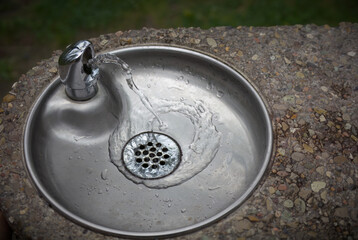 steel drinking water basin and stone drinking faucet