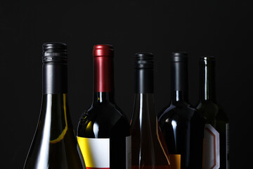 Black background and various luxurious wine bottles.