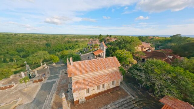 Smooth low-altitude flight over the medieval town of Altos de Chavon
