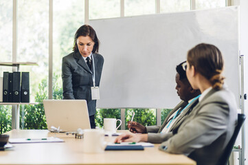 Group of business meeting and discussing strategy with startup project analysis finance process.Success business people plan and brainstorm marketing idea with laptop computer in office.Teamwork