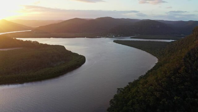 Aerial flyover at sunset of the scenic Hawkesbury River estuary, Australia