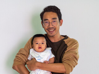 Man and baby Asian and nationality Thai is happy feel