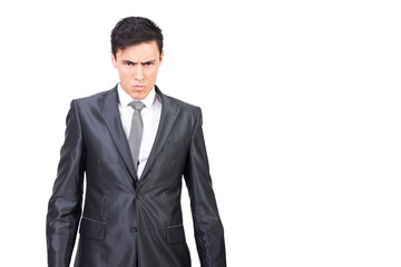 Serious young male manager looking at camera in white studio