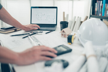 Architect engineer use laptop for check drawing design. House planning design and construction...