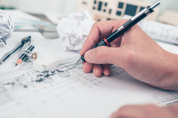 eraser crumbs and compass on drawing design working on bueprint. House planning design and...