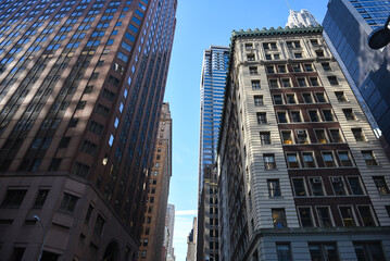 Fototapeta na wymiar Architecture of Manhattan. Skyscrapers office buildings from New York with impressive details. Landmarks of America. Wide angle view.