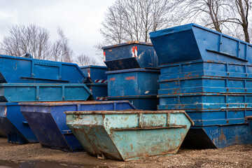 Blue metal scrap container on the street 