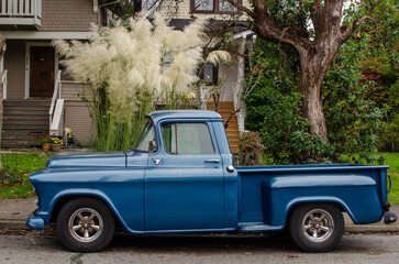 Blue track in front of house
