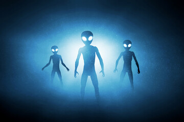 Silhouettes of aliens creature on dark background © fotokitas