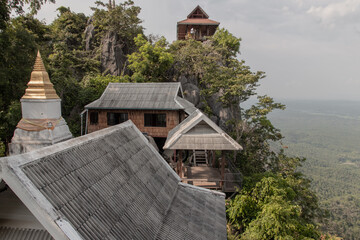 Fototapeta na wymiar Lampang, Thailand - Sep 03, 2020 : Pagoda on top of the cliff high mountain at Chaloem Phrakiat Phrachomklao Rachanuson temple (Wat Phrabat Pu Pha Daeng) Chae-Hom District, Lampang province, Unseen an