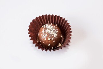 chocolate candy in a wrapper isolated on white